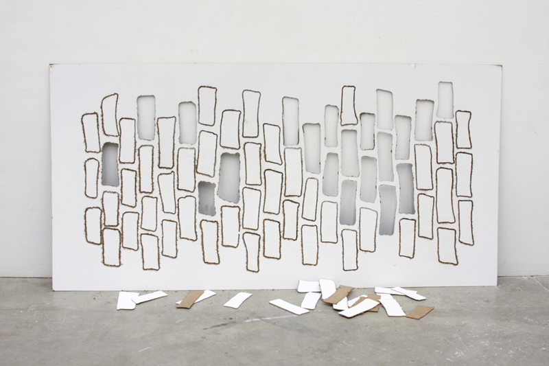 brick wall with its teeth knocked out